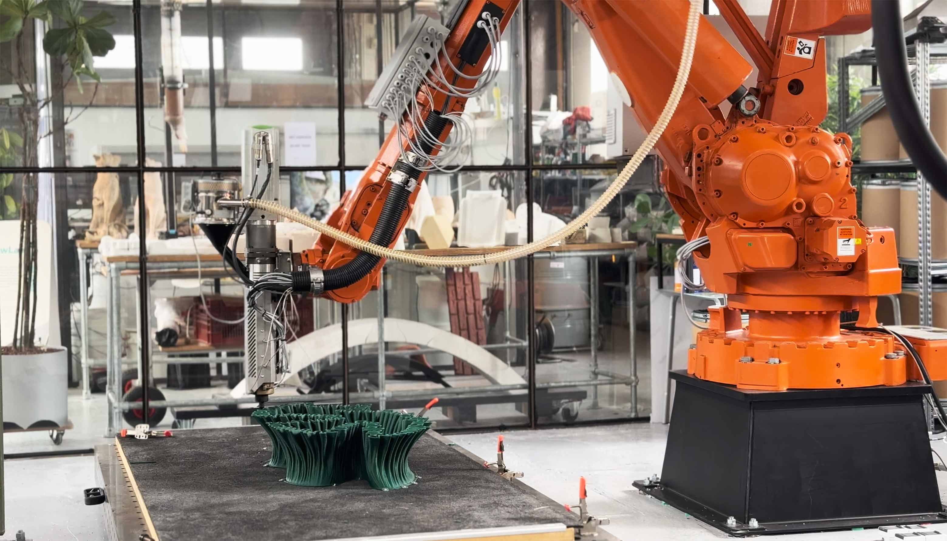 Industrial robotic arm performing large-format 3D printing